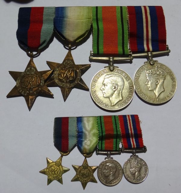 A group of four WW2 medals and miniatures.