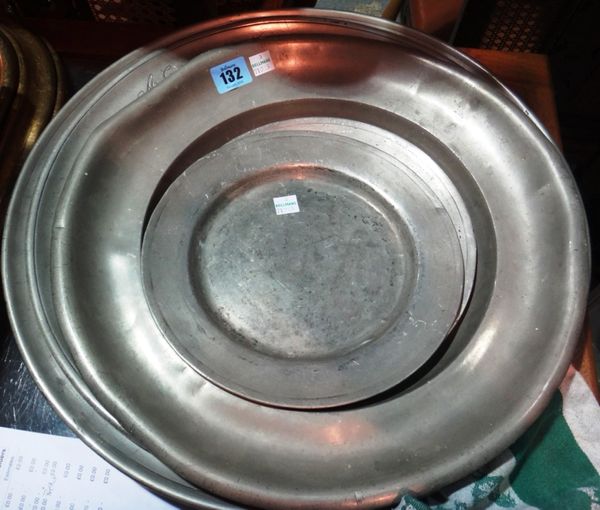 A pewter charger dated 1732, 43cm diameter, another dated 1792, a 19th century charger and two pewter plates (5).