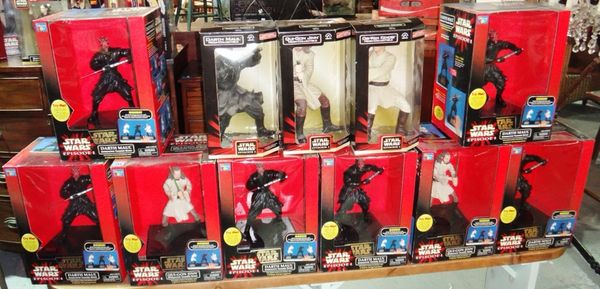 A group of large Star Wars toys, mostly boxed.