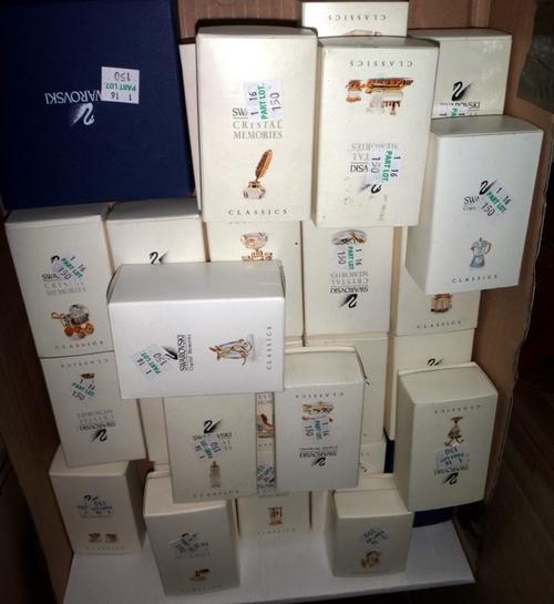 A group of twenty-eight boxed Swarovski crystal models.