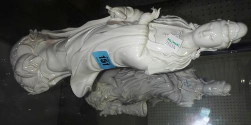 A pair of 20th century Oriental white glaze figures of Guanyin and another Oriental figure.