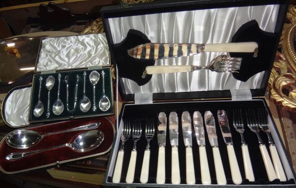 A set of six plated teaspoons and tongs with shell shaped bowls, cased Walker & Hall spoons and a cased set of fish servers.