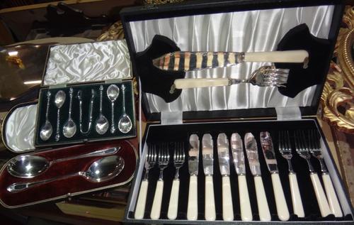 A set of six plated teaspoons and tongs with shell shaped bowls, cased Walker & Hall spoons and a cased set of fish servers.