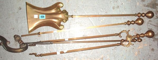 A set of four 20th century brass fire tools.