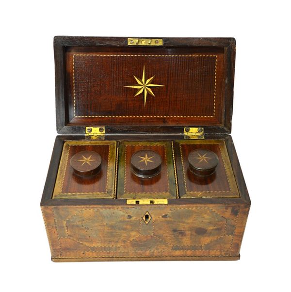 A George III inlaid mahogany tea caddy, with triple lidded canister interior, 26cm wide.  Illustrated