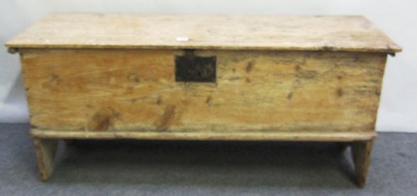 An 18th century pine five plank coffer on slab end supports, 120cm wide.