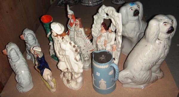 A quantity of Staffordshire pottery figures, including spaniels, flat back groups and sundry.