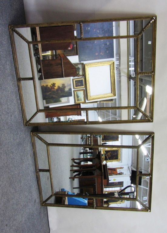 A pair of 20th century gilt framed segmented wall mirrors with split bobbin decoration, 77cm x 103cm.