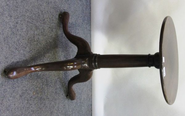 An 18th century mahogany occasional table, the circular top on a tripod base, 37cm wide.