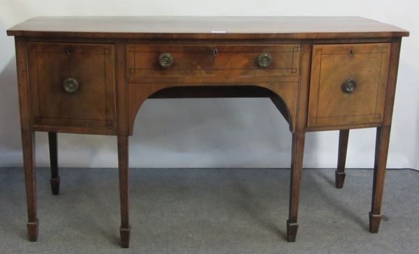 A George III inlaid mahogany bow front sideboard with three frieze drawers, on tapering square supports, 153cm wide.