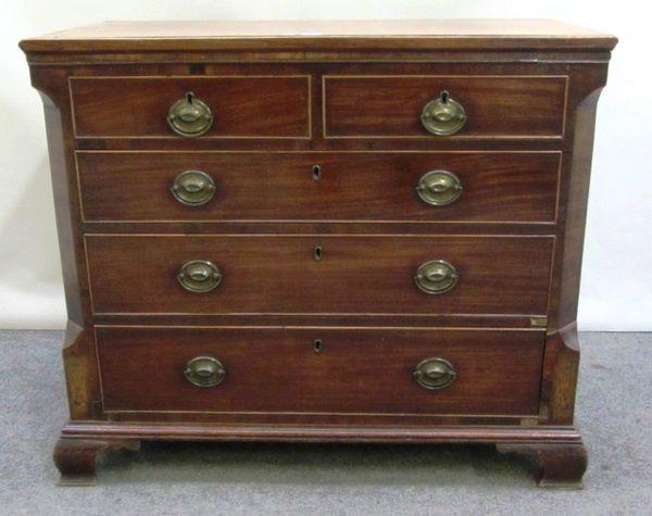 A mid 18th century mahogany chest of two short and three long graduated drawers, on ogee bracket feet flanked by canted corners, 94cm wide.