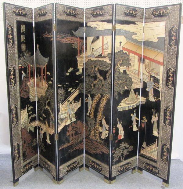 An early 20th century Chinese ebonised six fold draft screen 220cm wide x 182cm high.