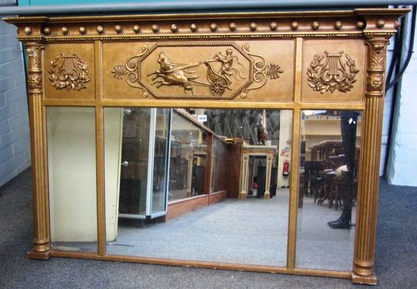 A late 19th century Regency style gilt framed overmantel triple plate wall mirror with chariot frieze, 145cm wide x 95cm high.