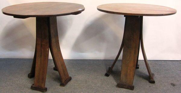 A pair of 19th century oak circular occasional tables, each on four splayed supports, 73cm wide.