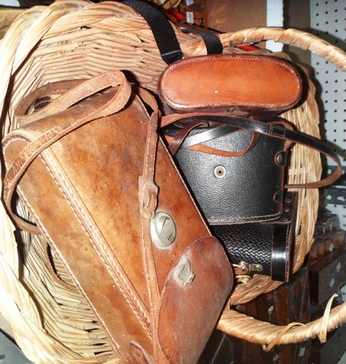 A quantity of assorted early 20th century binoculars and cameras.
