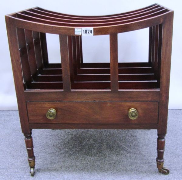 An early 19th century mahogany four division Canterbury, with concave top dividers over single drawer, on turned supports, 46cm wide.