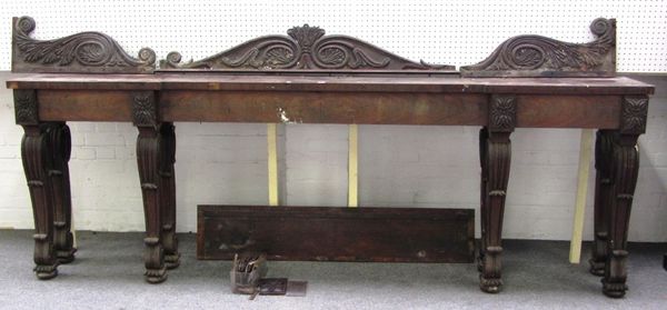 An early 19th century mahogany console table, with acanthus scroll galleried back and inverted break front frieze, on eight matching cabriole scroll s