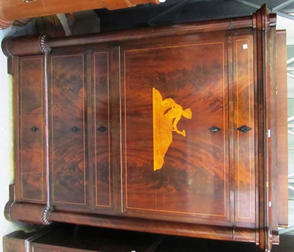 An early 19th century Continental mahogany marquetry inlaid secretaire a abattant, with one long drawer over a fall revealing a fitted interior and th