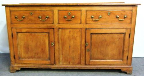 A George III pine dresser base, with three drawers over pair of cupboards, on bracket feet, 159cm wide.