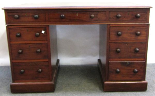 A Victorian mahogany pedestal desk with nine drawers about the knee, 129cm wide.