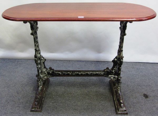 An early 20th century cast iron table base, with a later mahogany rounded rectangular top, 104cm x 49cm.