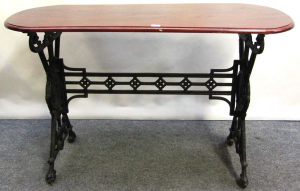 A Victorian cast iron table base with later mahogany rounded rectangular top, 120cm x 50cm.