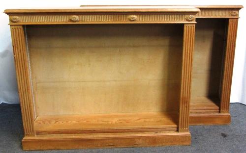 A pair of 18th century style waxed pine floor standing open bookcases with channelled decoration, on plinth bases, each 127cm wide.