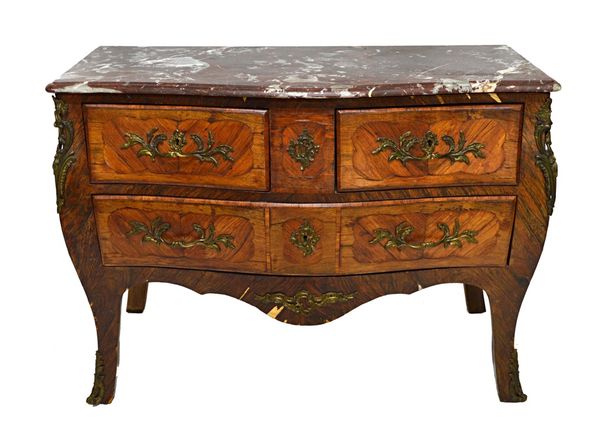 An 18th century style gilt metal mounted rosewood and kingwood commode, the serpentine marble top over a bombe base of two short and one long drawer,