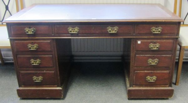 A Victorian mahogany pedestal desk with nine drawers about the knee, on plinth base, 137cm wide.