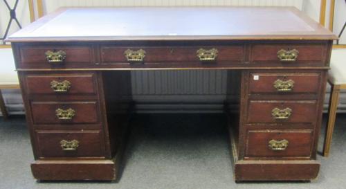 A Victorian mahogany pedestal desk with nine drawers about the knee, on plinth base, 137cm wide.