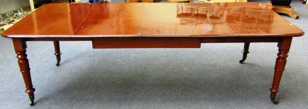 A Victorian mahogany extending dining table on turned tapering supports, to include a pair of extra leaves, 121cm wide x 122cm long x 256cm fully exte