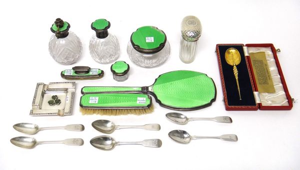 A lady's silver and green enamel mounted seven piece part toilet set, comprising; a scent bottle, a scent atomizer, a powder bowl, a small glass jar,