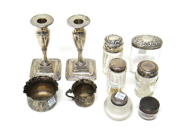 Silver and silver mounted wares, comprising; a pair of candlesticks, each on a square base, Sheffield 1913, height 14cm, a small cream jug with a matc