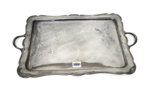 A silver shaped rectangular twin handled tray, Sheffield 1929, length including handles 49 cm, width 30 cm, weight 1487 gms.