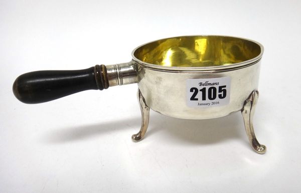 An Austrian silver saucepan, mark of Franz Ignaz Dermer, Vienna 1801, of circular form, raised on three feet and with an ebonised handle.