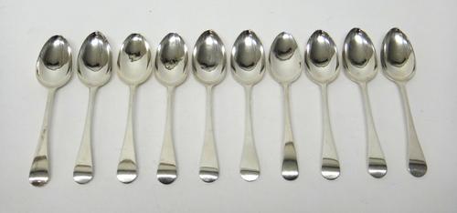 Ten silver Old English pattern dessert spoons, comprising; nine London 1818 and one London 1808, combined weight 374 gms.