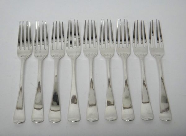 Nine silver Old English pattern dessert forks, each crest engraved, London 1823, combined weight 318 gms.