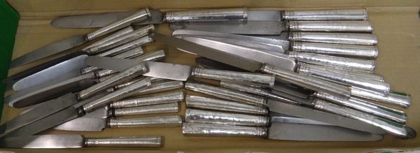 Thirty-three silver handled and steel bladed knives, in approximately three differing sizes, comprising; twelve table knives, some of the blades detai