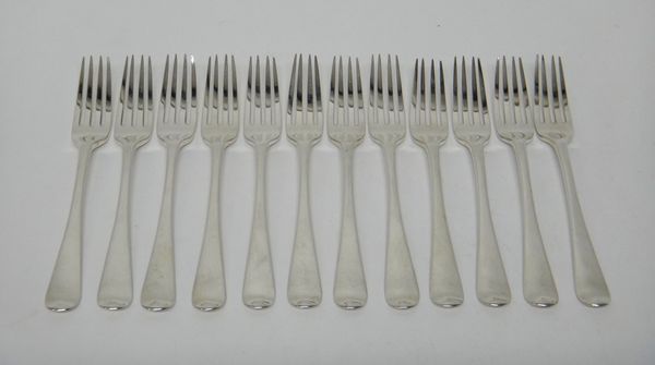 Twelve silver Old English table forks, London 1807, combined weight 858 gms.