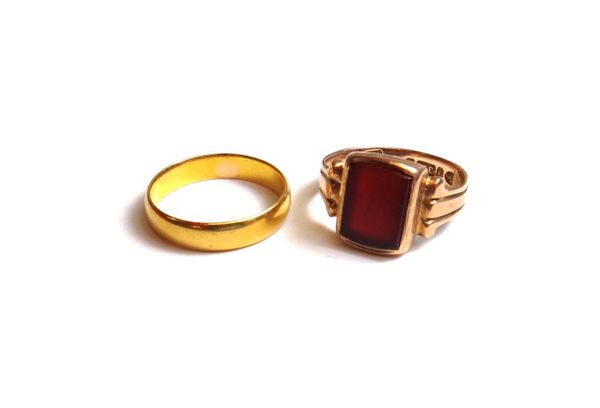 A 22ct gold plain wedding ring, weight 3.3 gms, ring size N and a 9ct gold and cornelian set signet ring, Chester 1898, ring size N and a half.