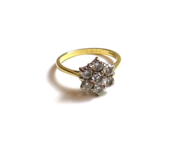 An 18ct gold and diamond set seven stone cluster ring, claw set with circular cut diamonds, detailed FEU 1.00, ring size R, gross weight 3.5 gms.