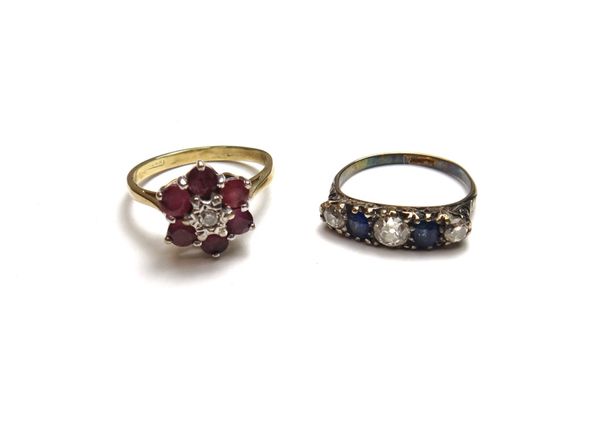 A gold, sapphire and diamond set five stone ring, mounted with three cushion shaped diamonds alternating with two cushion shaped sapphires, the mount