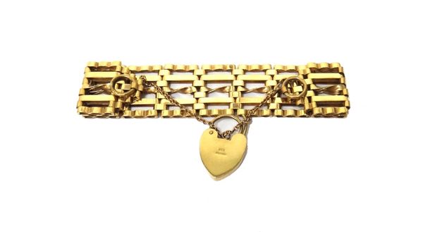 A 9ct gold bar, twisted bar and oval link gate bracelet, on a 9ct gold heart shaped padlock clasp, weight 26 gms.