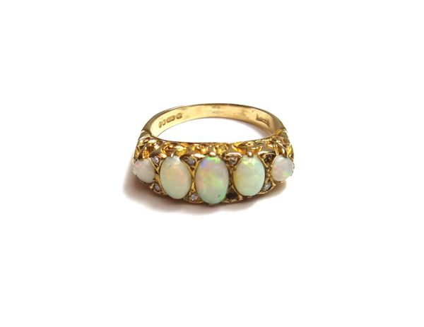 A 9ct gold and opal set five stone ring, mounted with a row of five graduated opals and with pairs of diamonds, mounted at intervals (one diamond lack