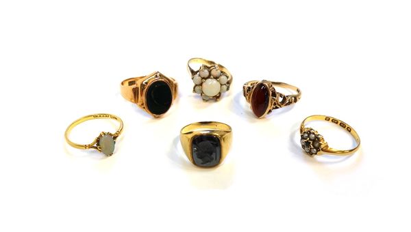 A gold and bloodstone set oval signet style ring, a gold ring, mounted with an oval opal, a gold and opal set cluster ring (one opal lacking), a 9ct g