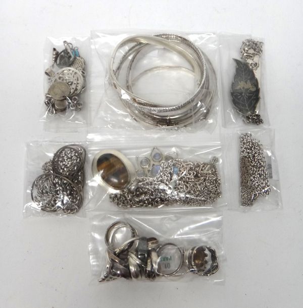 Mostly silver jewellery, comprising; four pendants with neckchains, six necklaces and neckchains, six bangles, fifteen pendants and charms, three brac