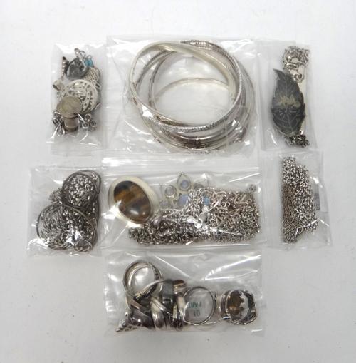 Mostly silver jewellery, comprising; four pendants with neckchains, six necklaces and neckchains, six bangles, fifteen pendants and charms, three brac