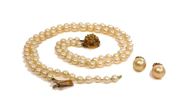 A two row necklace of graduated cultured pearls, on a 9ct gold circular clasp, cast and pierced in a textured design and a pair of imitation pearl ear