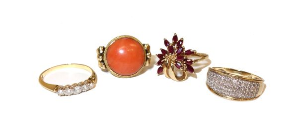 A gold and diamond set five stone ring, mounted with a row of cushion shaped diamonds, graduating in size to the centre stone, a 9ct gold and ruby set