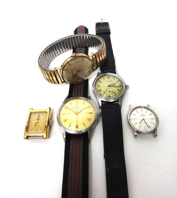 A lady's gilt metal fronted and steel backed rectangular cased Omega Automatic De Ville wristwatch, a lady's steel circular cased Omega Quartz De Vill